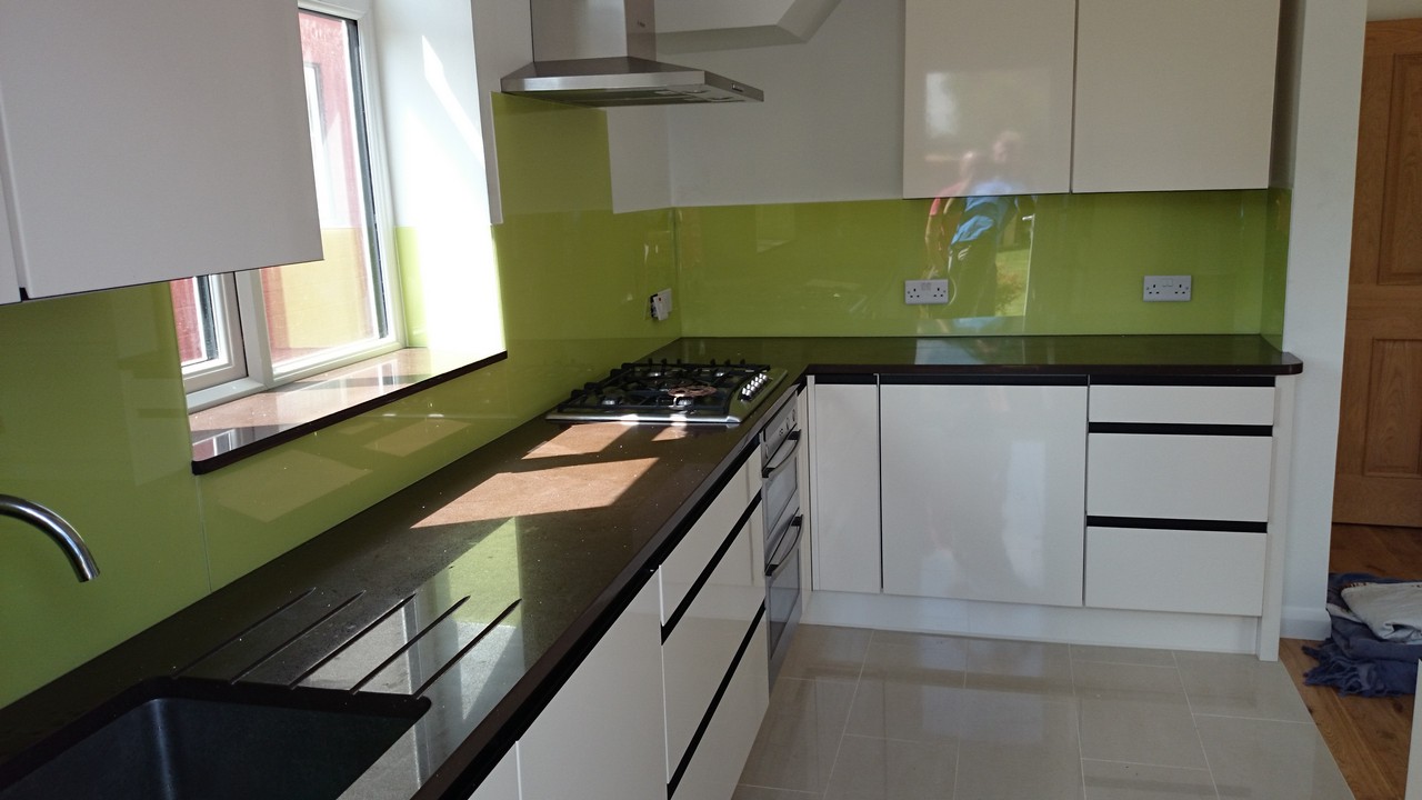 Lime green glass kitchen splashback installed by Caterham glaziers