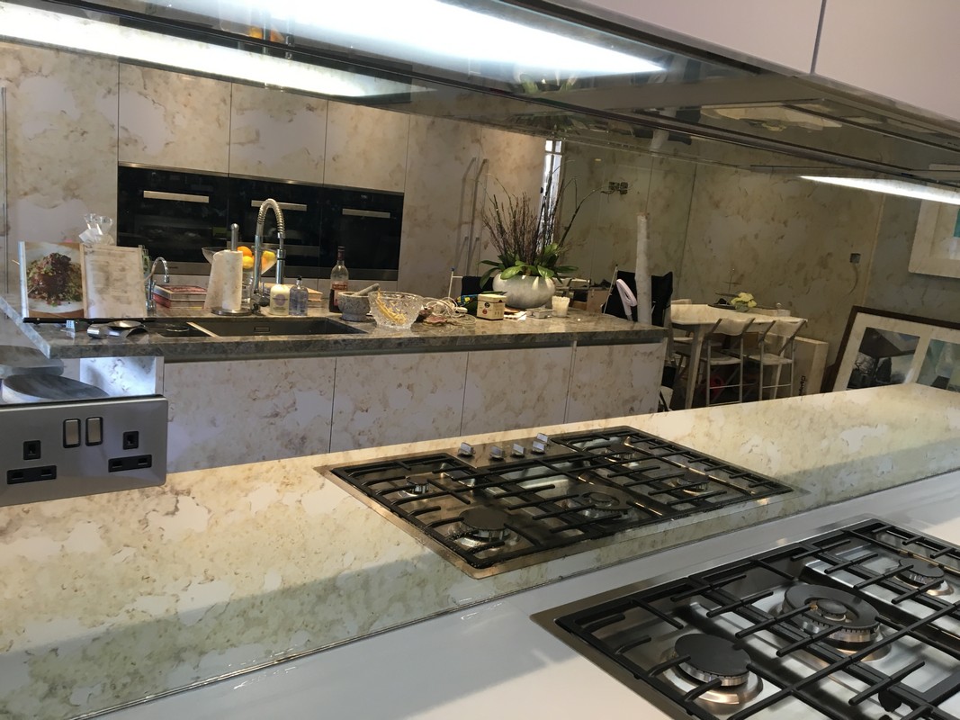 Mirror glass splashback in Caterham luxury kitchen