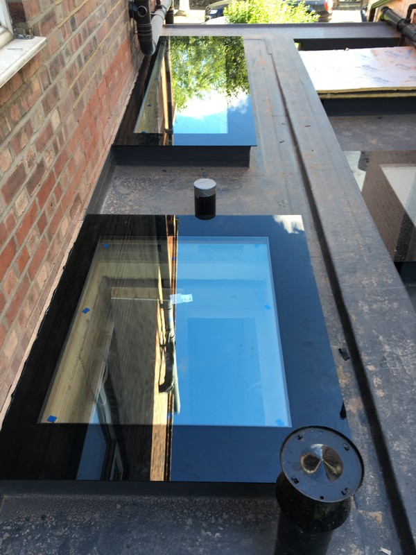 Multiple flat roof skylights on extension in Caterham